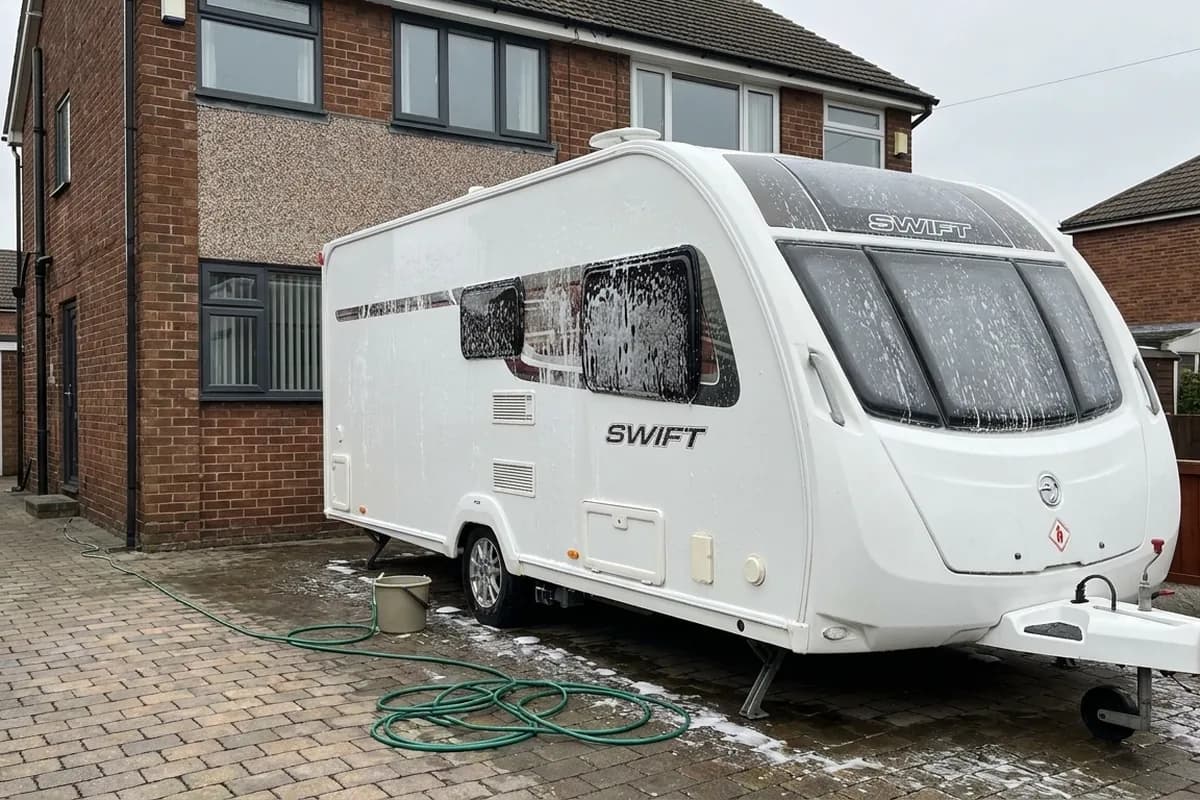 Touring caravan being valeted back to showroom condition on the drive