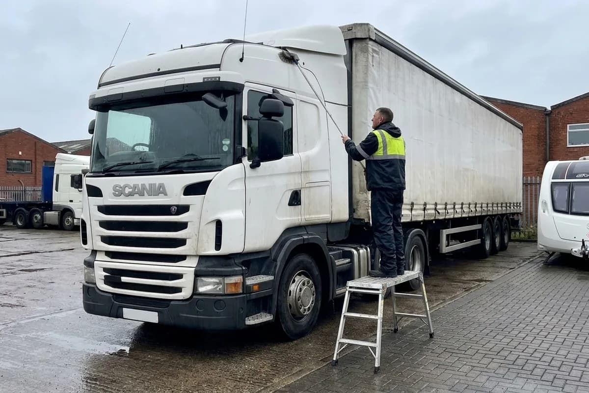 Truck and trailer being washed on the yard
