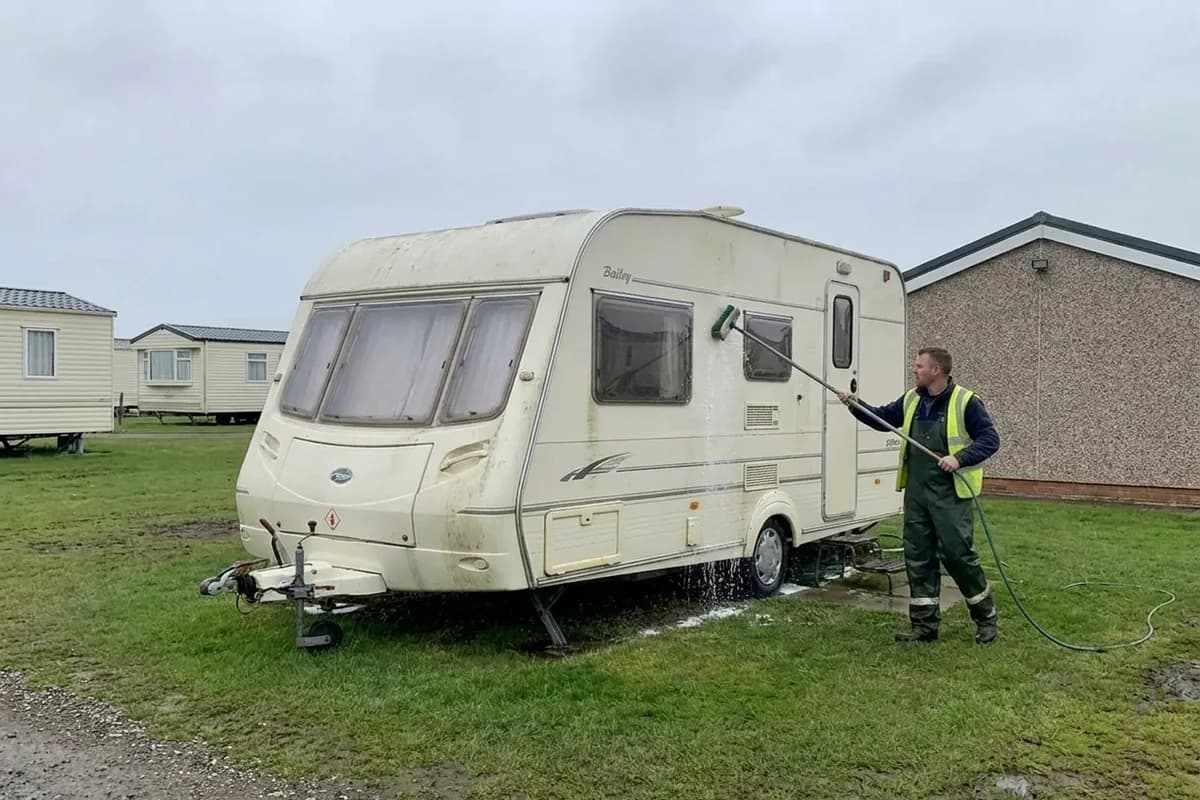 Static caravan being washed on its pitch at a coastal holiday park