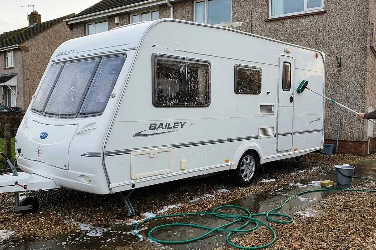 Touring caravan being valeted